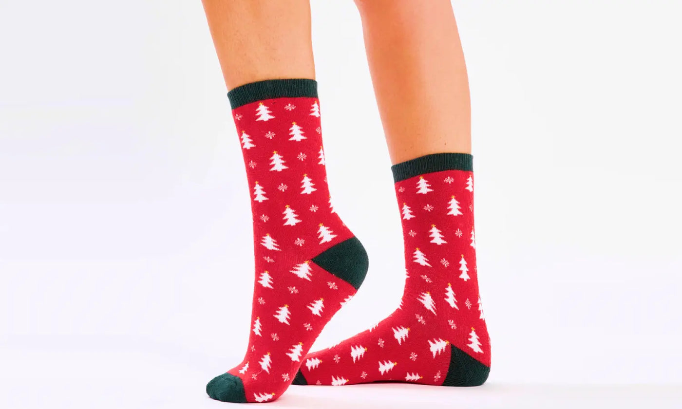 a person's legs with red socks